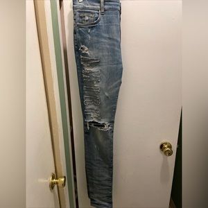 Selling Amiri Logo Applique Jeans.